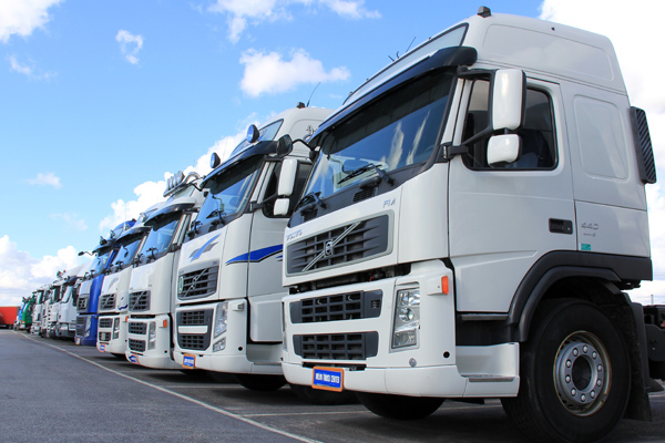 Photo of a commercial fleet of trucks - Links to Commercial Auto Insurance page